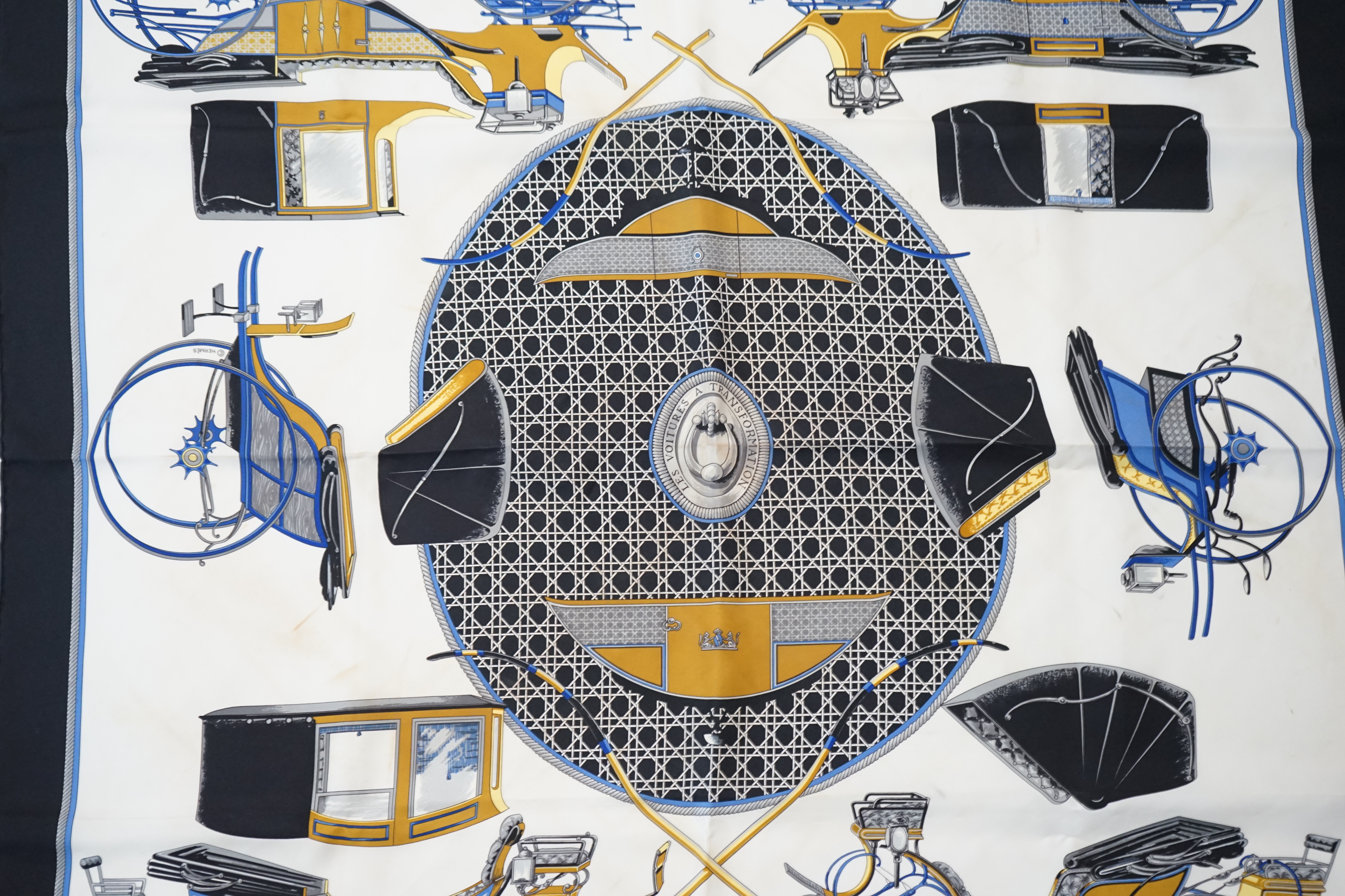 A Hermès Les Voitures a Transformation by Francoise de la Perriere black and white silk scarf, approx 90cm x 90cm